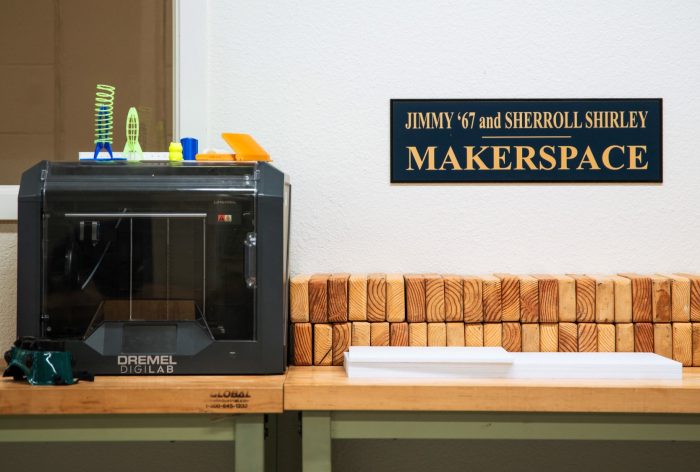 A digital lab machine on a bench with a plaque of Jimmy and Sherroll.